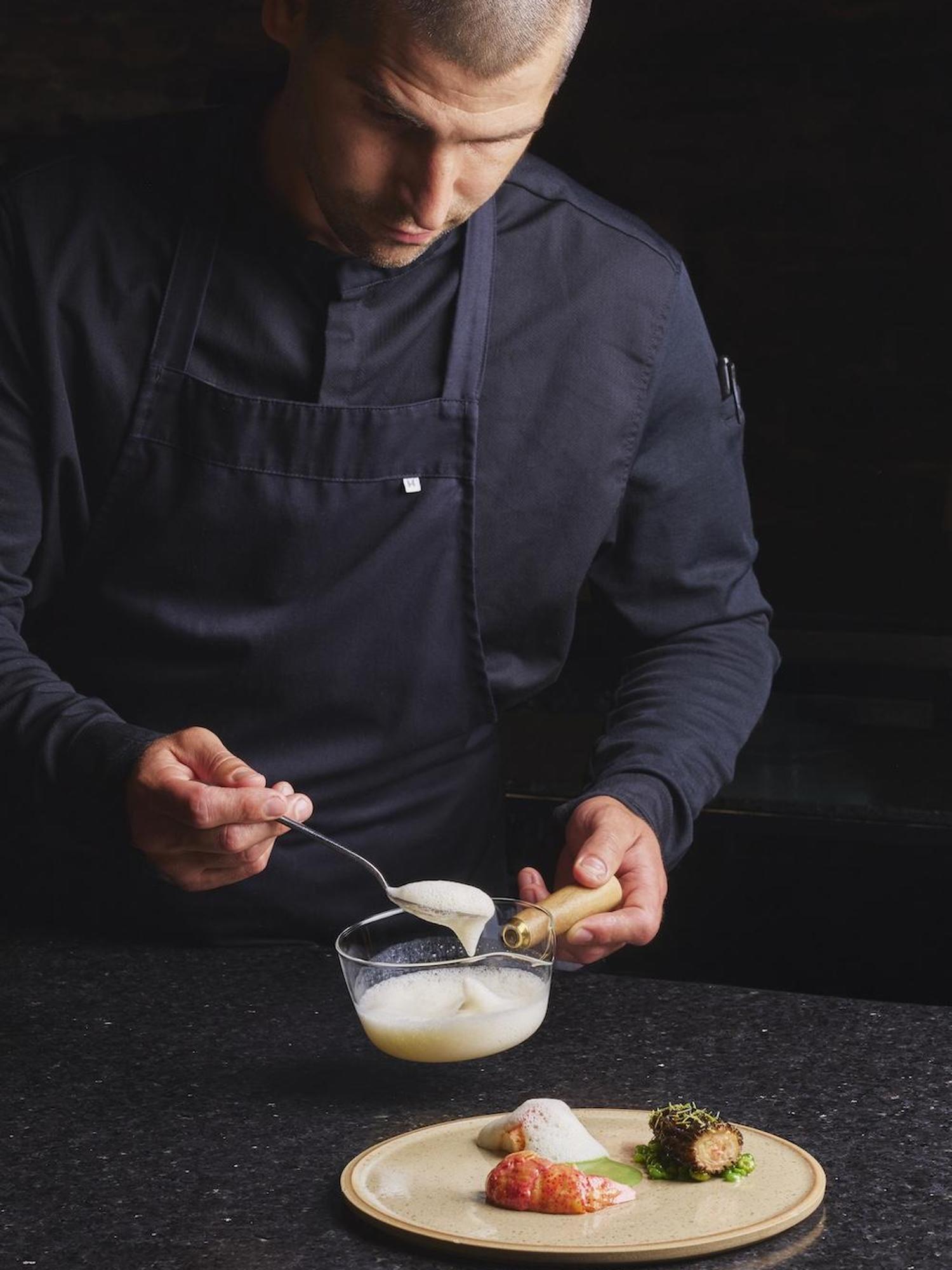 A Tani\u00e8re\u00b3 chef assembles a meal on a plate
