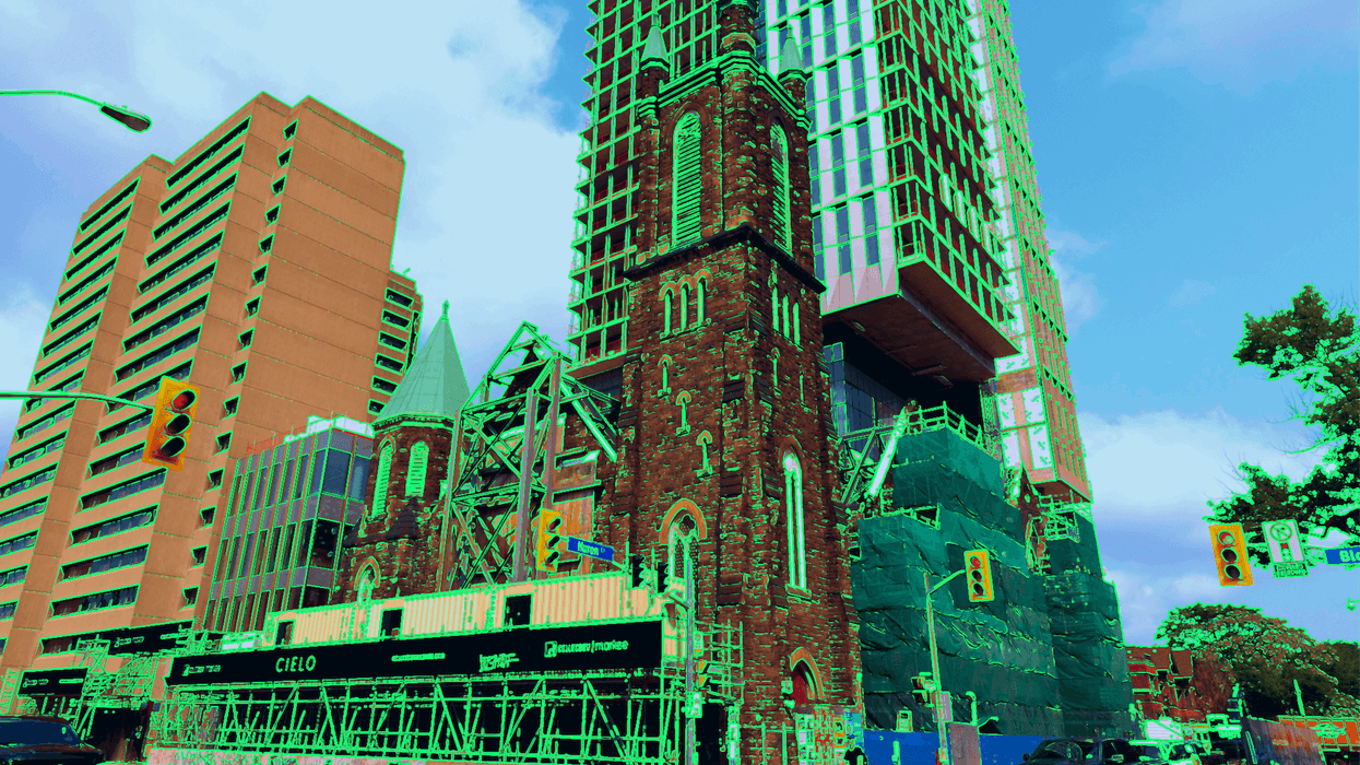Bloor Street United church in toronto, mostly demolished with condo construction overhead