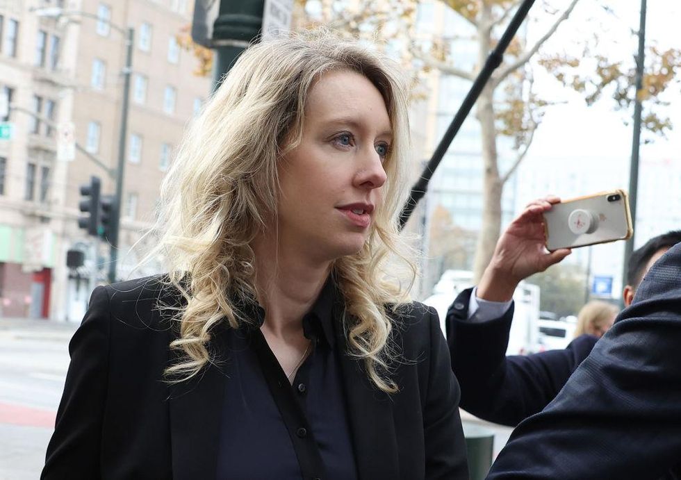 Elizabeth Holmes arriving at a courthouse