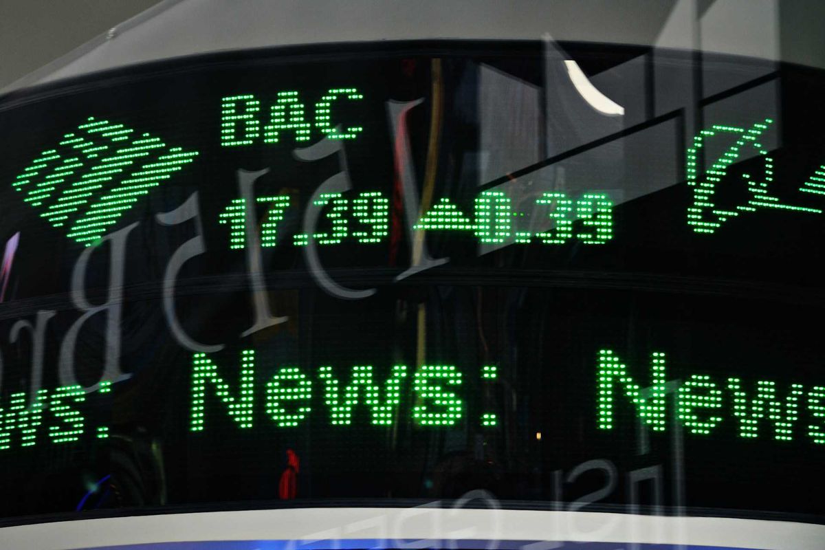 Green financial ticker displaying stock info.