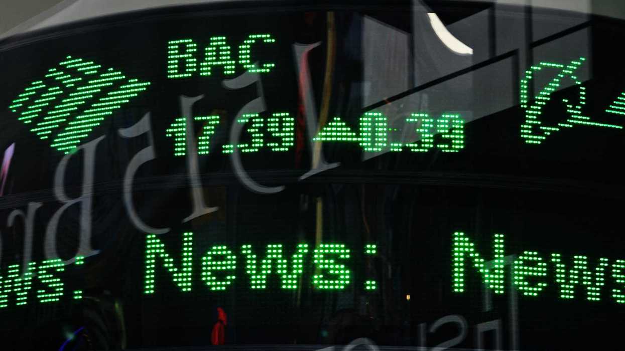Green financial ticker displaying stock info.