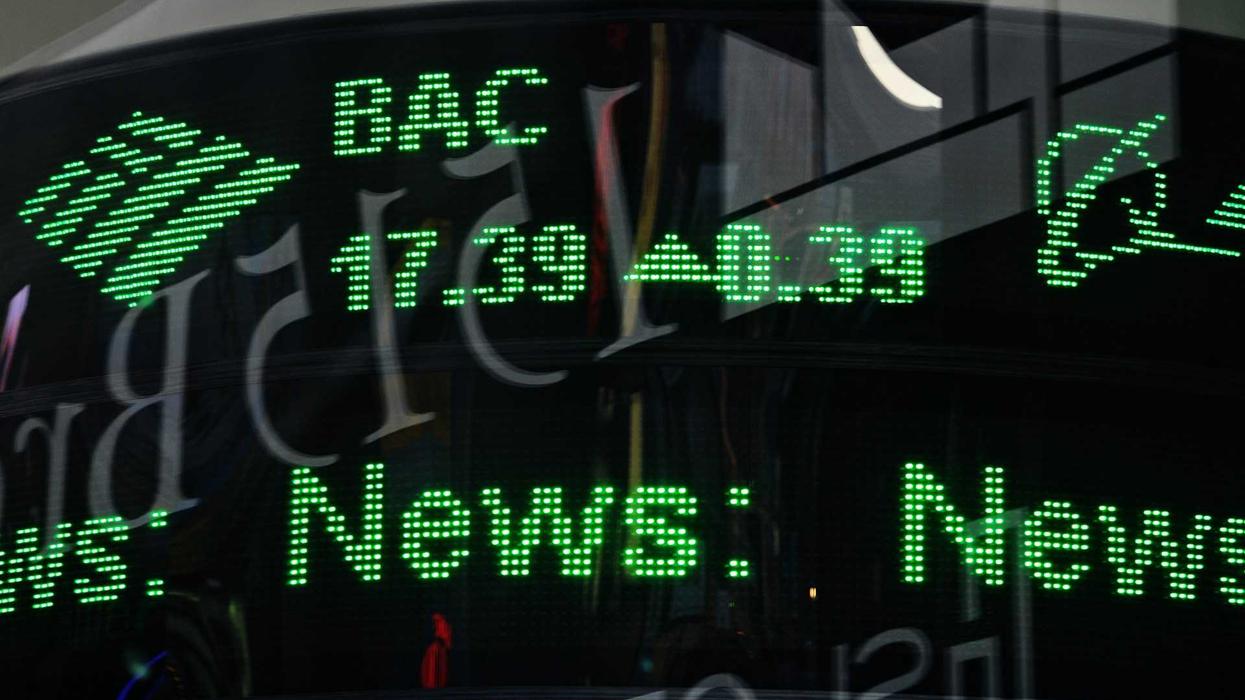 Green financial ticker displaying stock info.