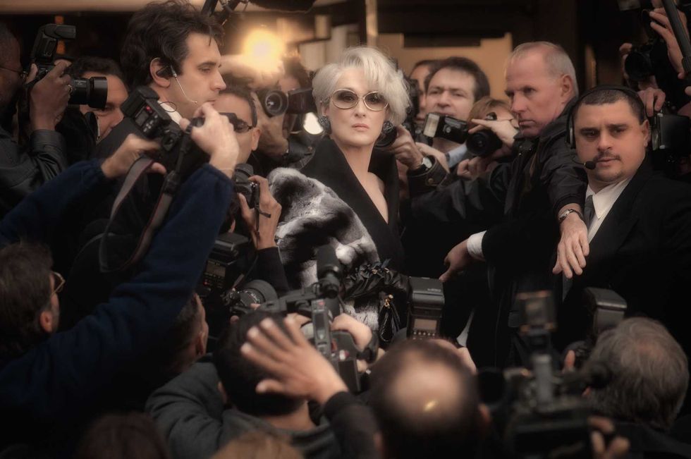Meryl Streep as Miranda Priestly surrounded by paparazzi in The Devil Wears Prada