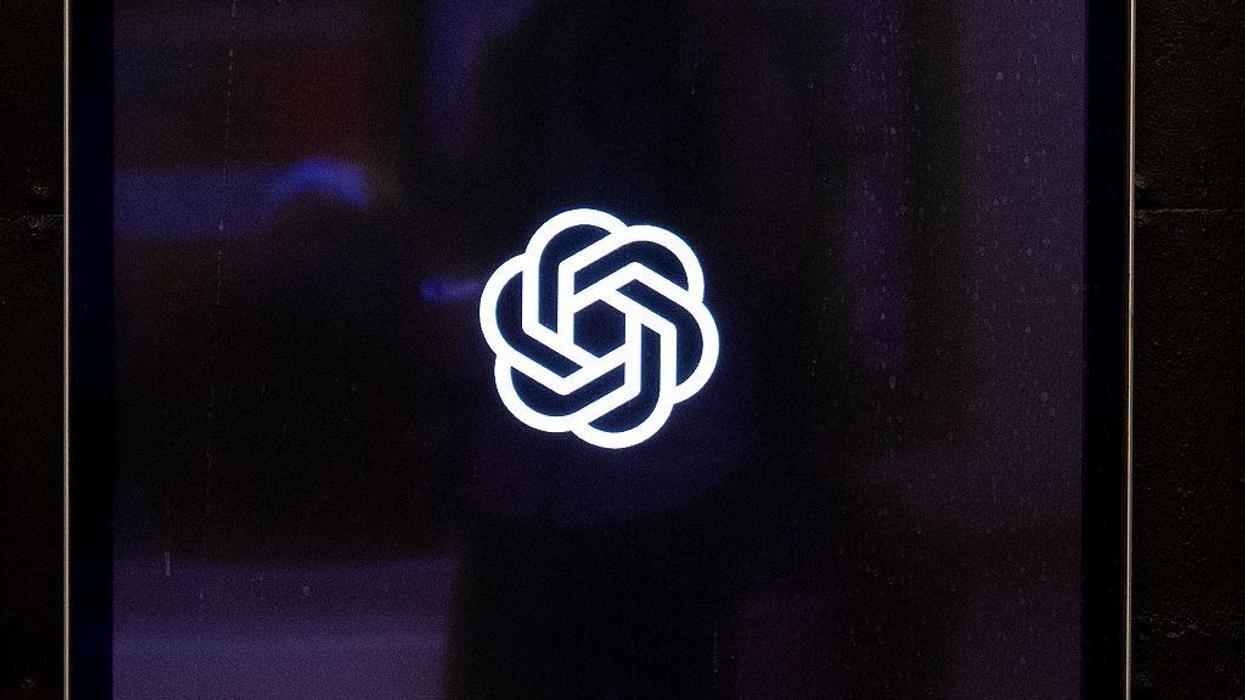 OpenAI's logo appears on a dark digital screen.