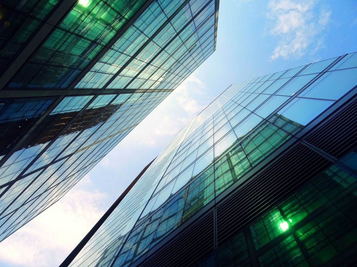 Reflective glass skyscrapers stretch into the air