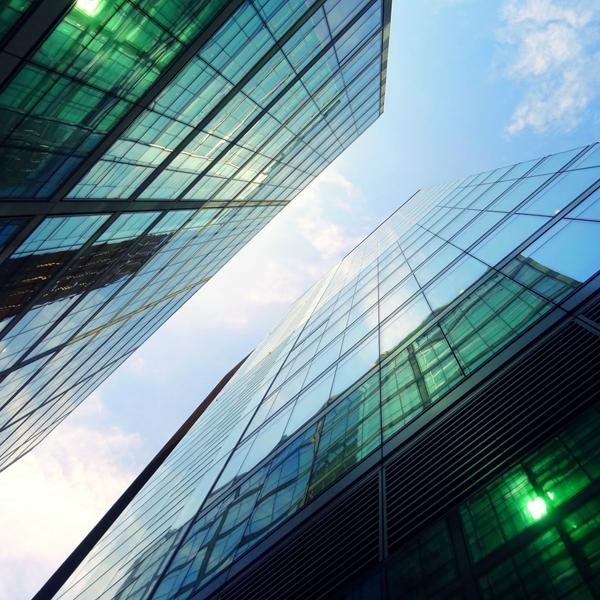 Reflective glass skyscrapers stretch into the air