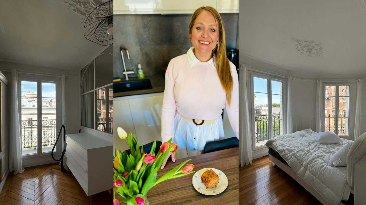 Smiling woman in her Paris kitchen with tulips & pastry, flanked by her apartment rooms with city views