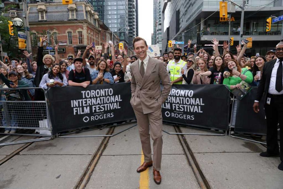 Tom Hiddleston poses with fans at the Toronto International Film Festival in 2024