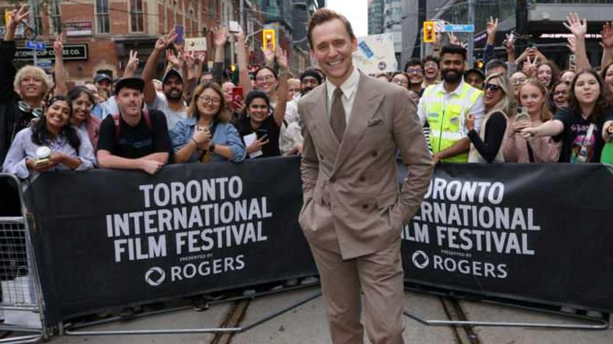 Tom Hiddleston poses with fans at the Toronto International Film Festival in 2024