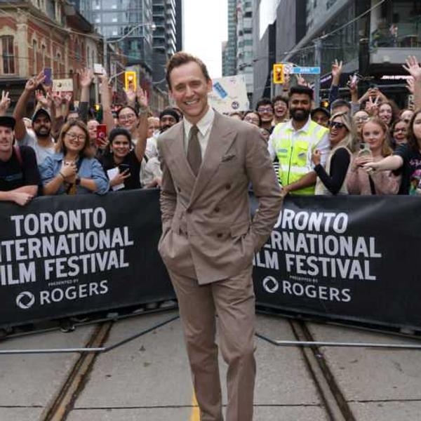 Tom Hiddleston poses with fans at the Toronto International Film Festival in 2024